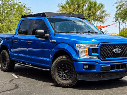 Side View of Roof Rack on F150 Raptor Kingdom Overlanding aluminum roof rack on a 2023 Ford F150 Raptor SuperCrew, with 7 crossbars for cargo, kayaks, or tents