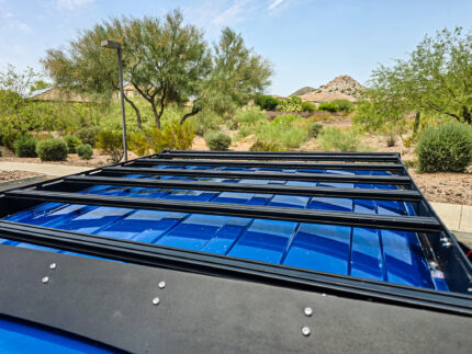 Top-Down View with Crossbars Kingdom Overlanding Ford F150 Raptor roof rack with black powder-coated aluminum crossbars, 600 lbs capacity, 2015-2025